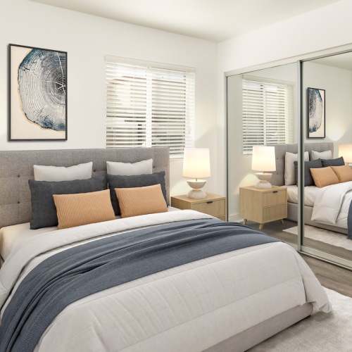 bed near closet with mirror